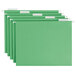 A row of green Smead hanging file folders with white repositionable tabs.