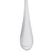 A Libbey stainless steel dessert spoon with a heart shaped handle.