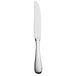 A Libbey stainless steel dinner knife with a serrated edge and solid handle with a silver finish.