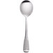 A close-up of a World Tableware stainless steel bouillon spoon with a black handle.