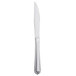 A Libbey Cortland stainless steel steak knife with a fluted solid handle.