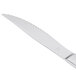 A Libbey Cortland stainless steel steak knife with a fluted silver handle.