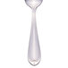 A silver Libbey demitasse spoon with a clear handle on a white background.
