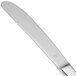 A Libbey stainless steel dinner knife with a serrated solid handle.