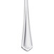 A Libbey stainless steel cocktail fork with a white handle.