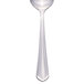 A silver Libbey Cortland dessert spoon with a white background.