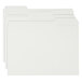 A stack of white Smead file folders with 1/3 cut tabs.