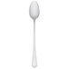 A stainless steel iced tea spoon with a white handle and a black top on a white background.