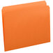 A close-up of a Smead orange letter size file folder with a flap on the top and a reinforced straight cut tab.
