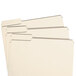 Three Smead letter size file folders with 1/3 cut left tabs on a white surface.