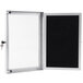 An Aarco black felt message board with a white door and aluminum frame with a key in the lock.