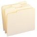 Several Smead 100% recycled manila file folders with white tabs.