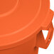 An orange plastic lid for a Carlisle Bronco trash can.
