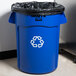 A blue Rubbermaid Brute recycling can with a black bag inside.