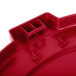 A red plastic Carlisle Bronco lid for a round container.