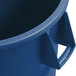 A Carlisle blue plastic round trash can with a handle.