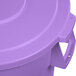 A close-up of a Carlisle purple plastic trash can lid.