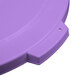 A purple plastic Carlisle Bronco trash can lid with a handle and holes.
