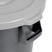 A close-up of a gray Continental round trash can with a gray lid.
