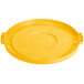 A yellow plastic lid with a circle on top.