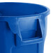 A blue Rubbermaid Brute recycling can with a handle.