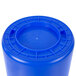 A blue plastic Continental Huskee recycling/trash can with a white lid.