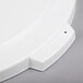 A close-up of a white Carlisle Bronco trash can lid with a small hole in it.