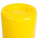 A yellow plastic container with a yellow lid.