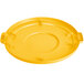 A yellow plastic Carlisle Bronco trash can lid with four holes and a handle.
