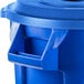 A blue Rubbermaid plastic recycling can with a recycling lid.