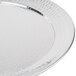An American Metalcraft 20" round stainless steel tray with a hammered design.