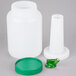 A white plastic container with a green spout and cap.