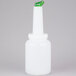 A white bottle with a green spout and cap.