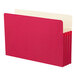 A stack of red file folders with white tabs.