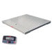 A white Tor Rey industrial floor scale with a digital screen.