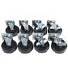 A set of 8 black and silver Vulcan swivel plate casters with black rubber wheels and metal caps.