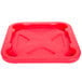 A red square Rubbermaid lid with a cross on it.