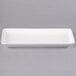 A white rectangular porcelain coupe platter with a handle.