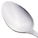 A close-up of a Libbey stainless steel teaspoon with a silver handle.