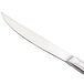 A Libbey stainless steel steak knife with a fluted silver handle.