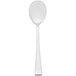 An Arcoroc stainless steel dinner spoon with a white handle and silver spoon.