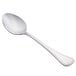 A Libbey stainless steel serving spoon with a silver handle.