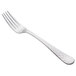 A silver Libbey Aspire dinner fork with a white handle.