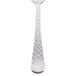 The handle of a Libbey stainless steel dinner fork with a white background.