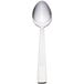 A Libbey stainless steel dessert spoon with a white handle and silver spoon end.