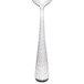 A Libbey stainless steel teaspoon with a textured pattern on the handle.