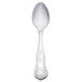 A Libbey stainless steel dessert spoon with a design on the handle.