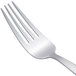An Arcoroc Satineo stainless steel dinner fork with a silver handle.