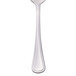 A Libbey dessert spoon with a stainless steel bowl and white handle.