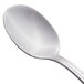 A Libbey demitasse spoon with a stainless steel handle.